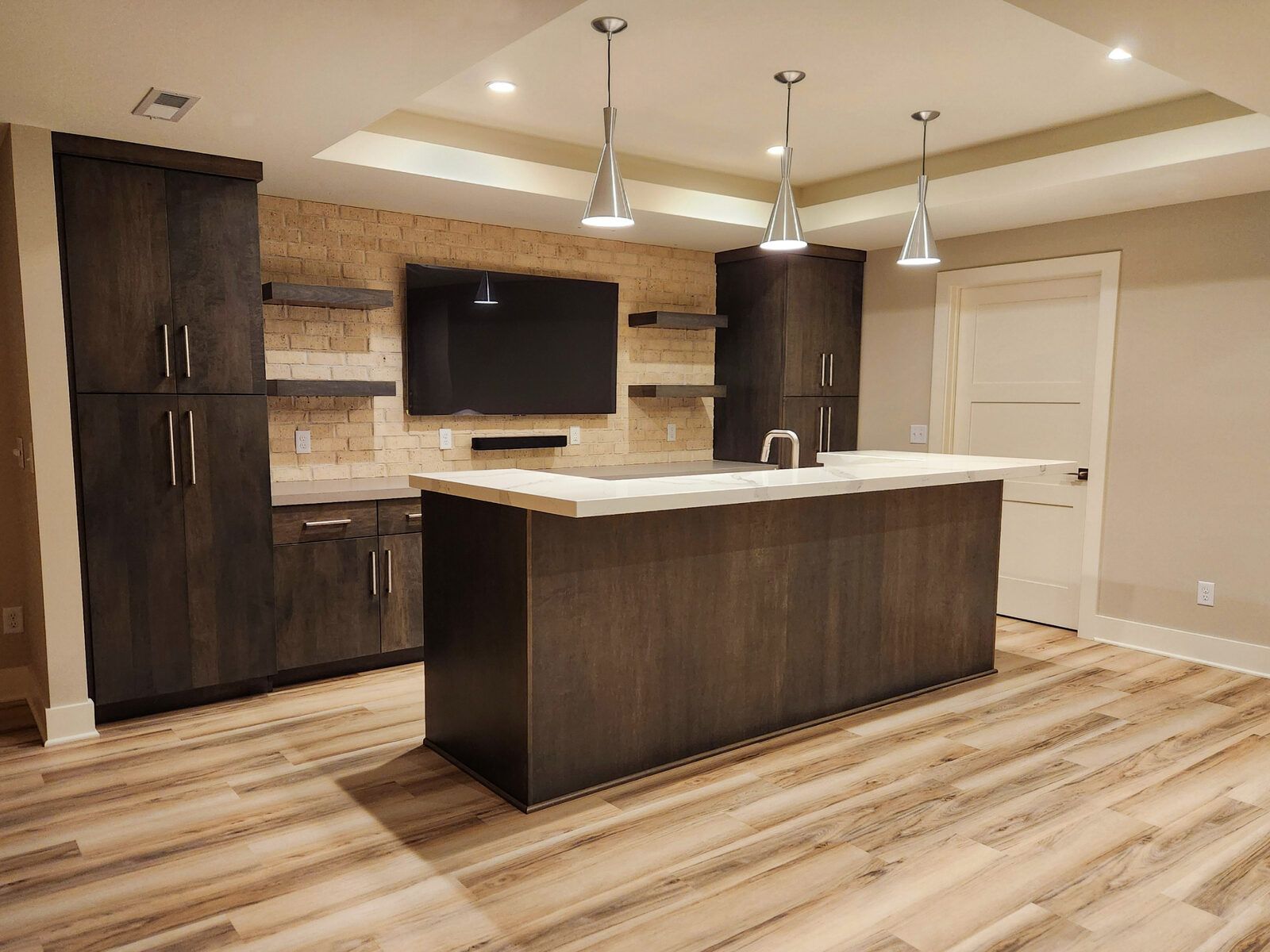Quartz basement bar with sink and seating