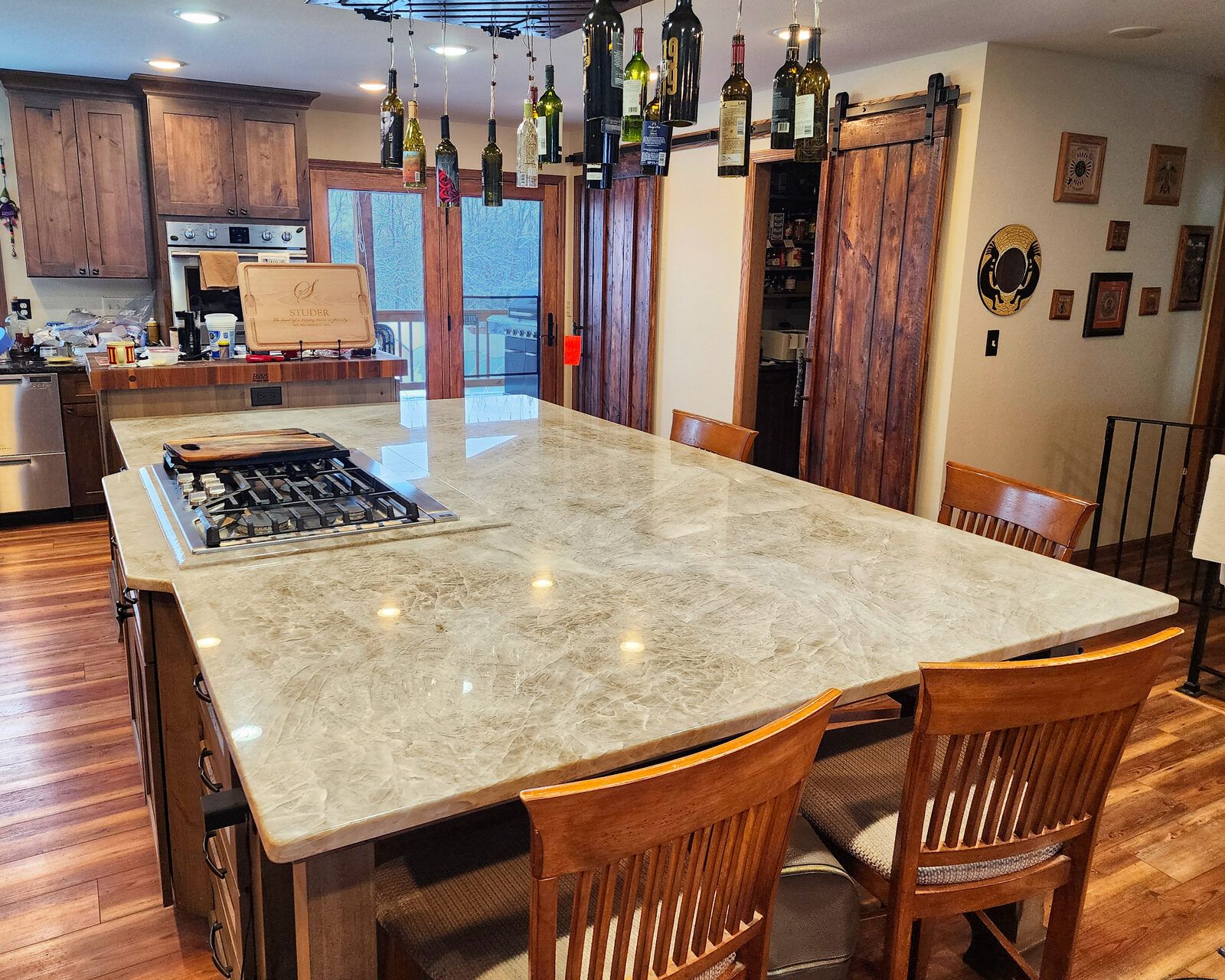 Quartzite kitchen island with cooktop in a Waukesha home
